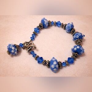 Blue Beaded Bracelet with White Florals and Heart & Anchor Closure